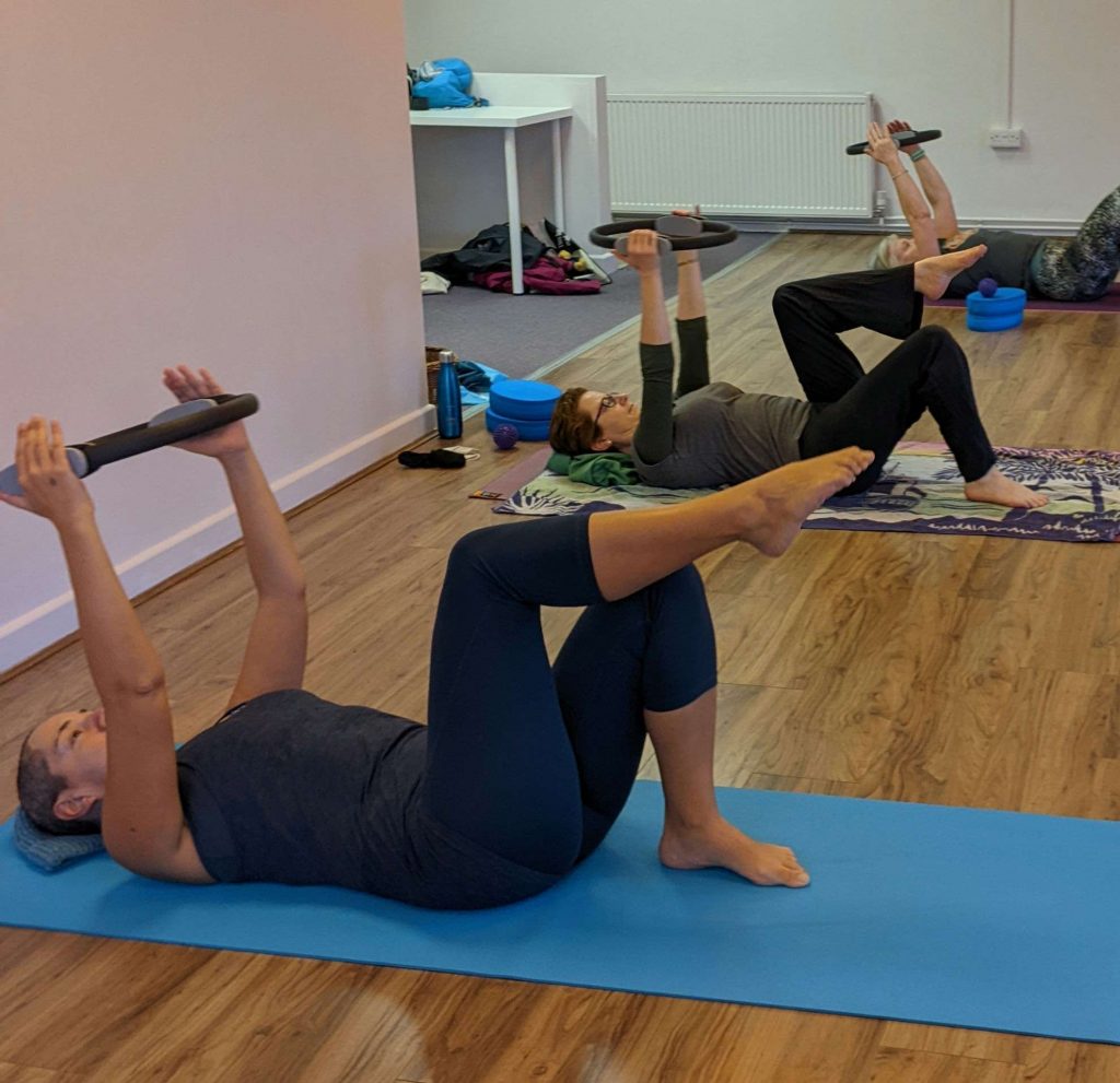 Pilates session using the magic circle