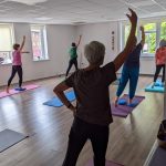 Participant practising a standing balance exercise